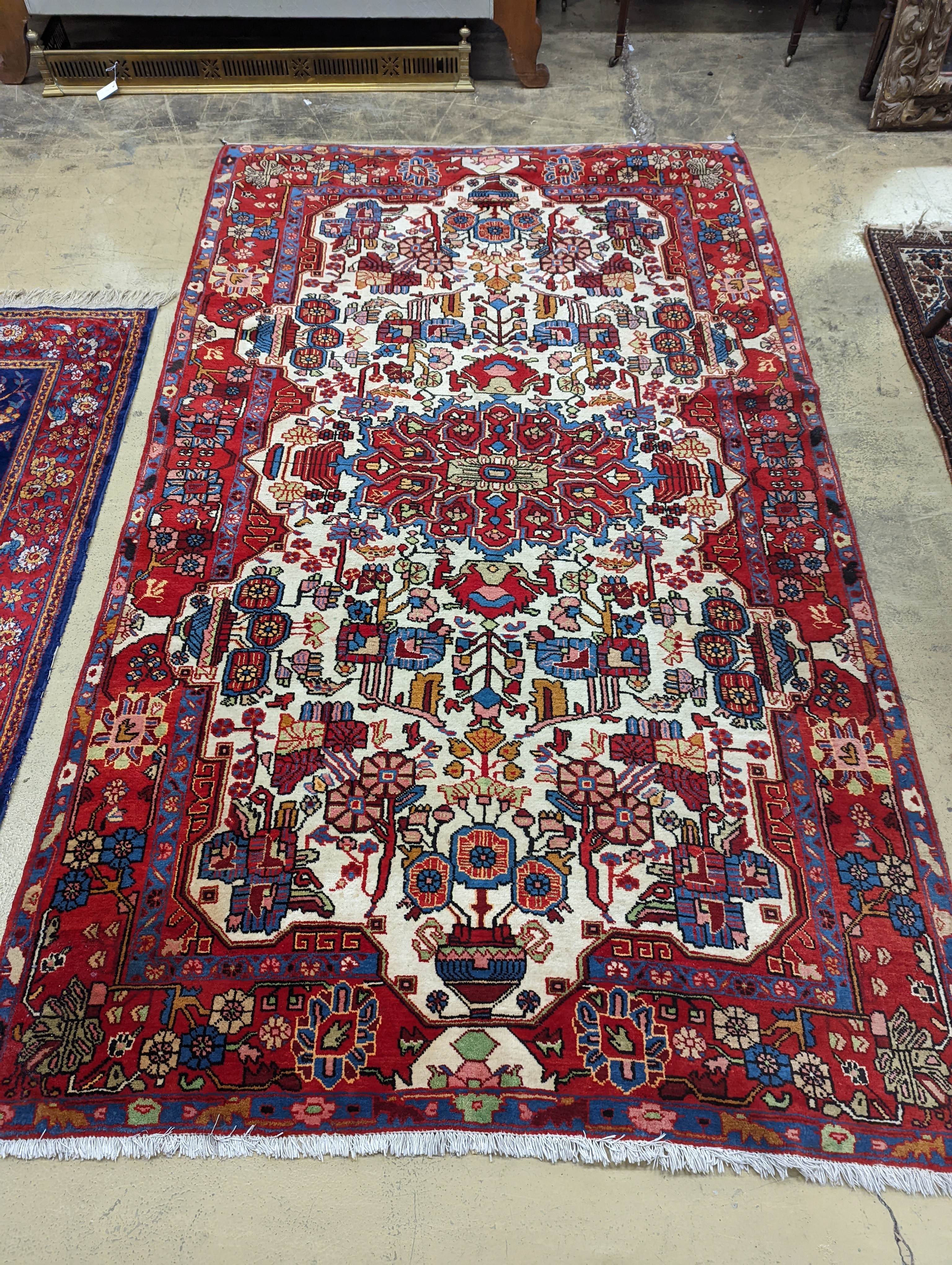 A Caucasian design ivory ground carpet, 260 x 158cm together with a smaller Tabriz style Tree of Life rug